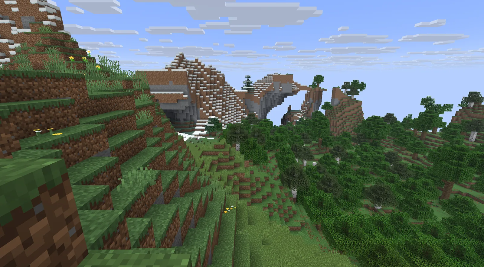A green valley with forests and mountains